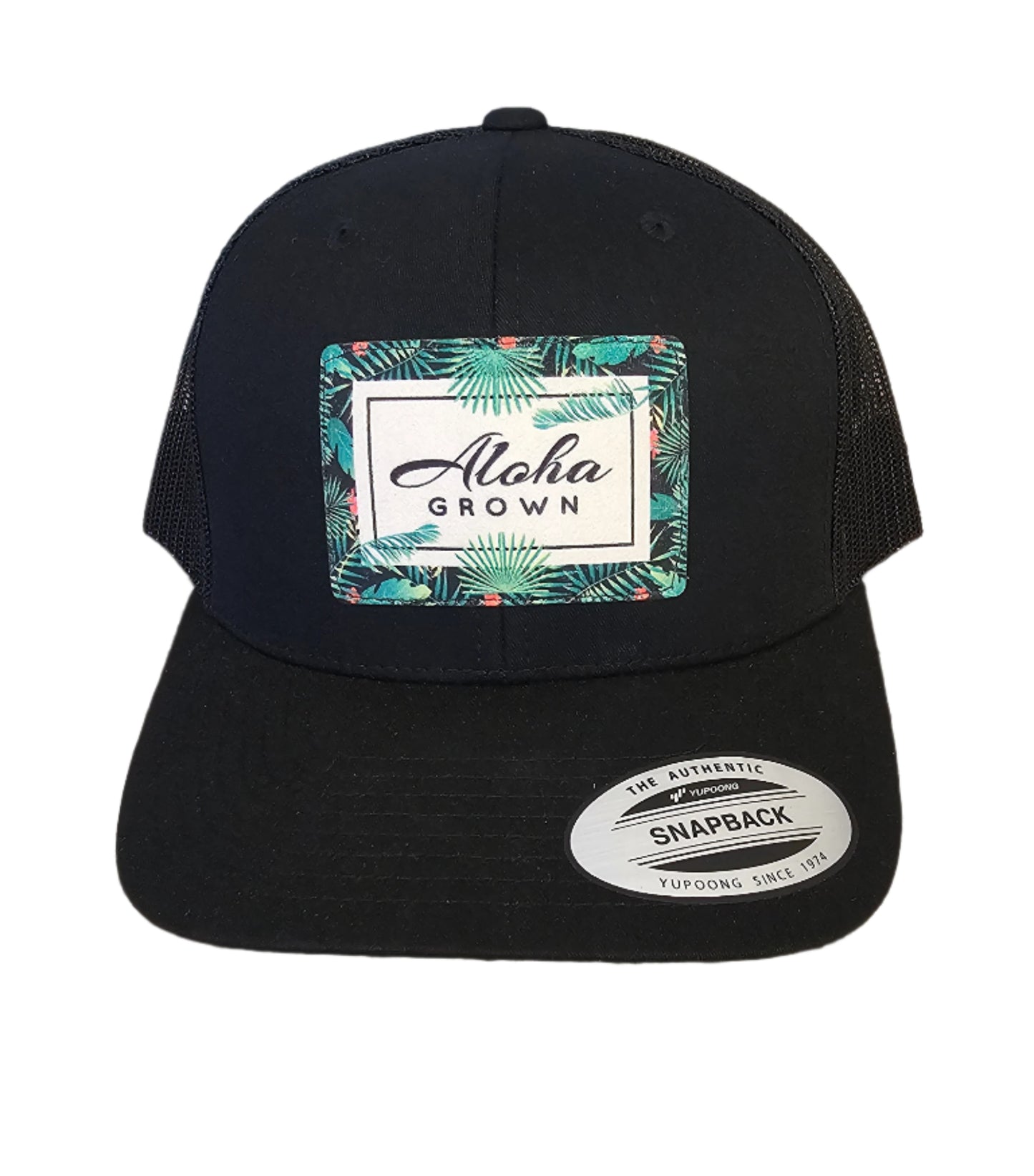 Black cap with a brand label on a granite surface