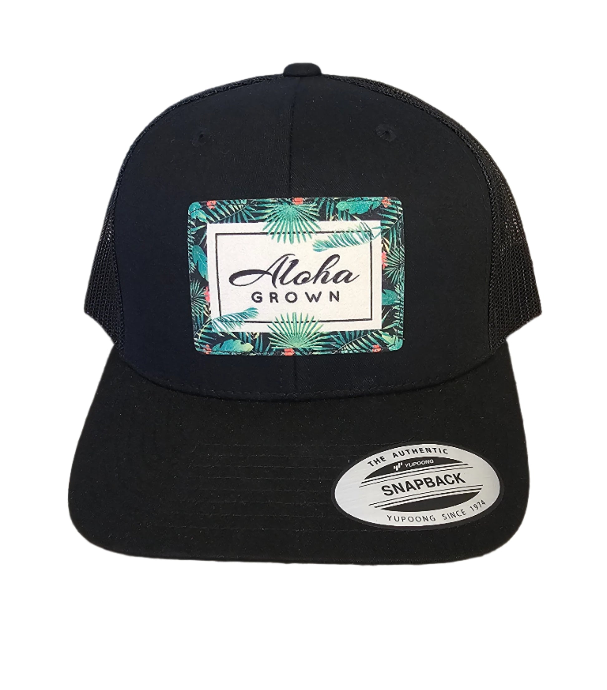 Black cap with a brand label on a granite surface